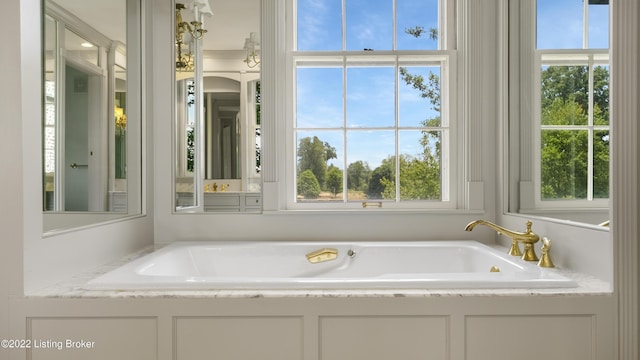 bathroom with a tub to relax in