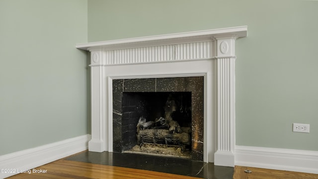 details featuring a tile fireplace