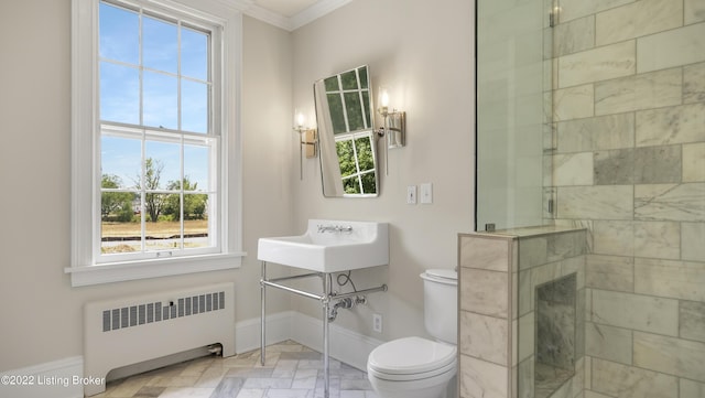 bathroom featuring a wealth of natural light, radiator heating unit, crown molding, toilet, and a shower with door