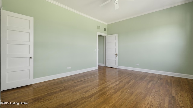 empty room with crown molding, ceiling fan, and dark wood-type flooring