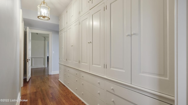 corridor with dark wood-type flooring