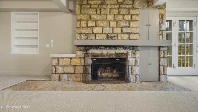 room details with carpet flooring and a fireplace