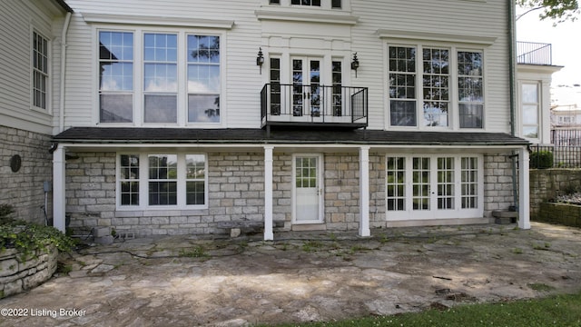 rear view of house featuring a balcony