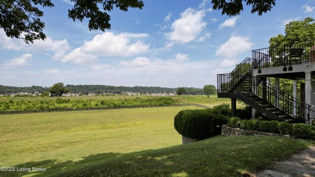 view of yard with a rural view