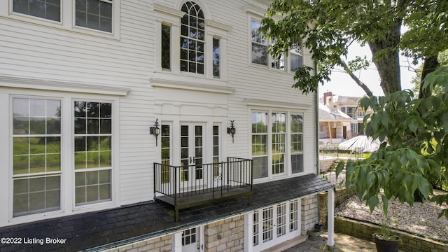 rear view of property with french doors