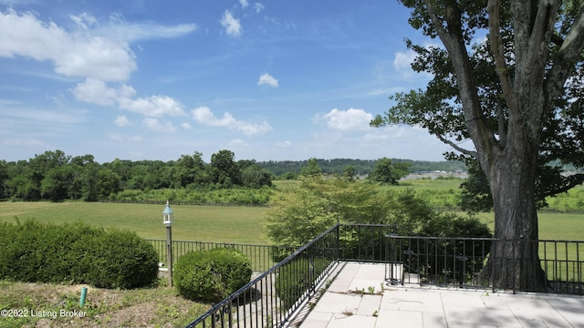 exterior space with a lawn and a rural view