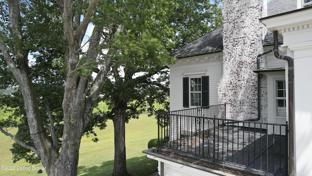 view of home's exterior with a lawn