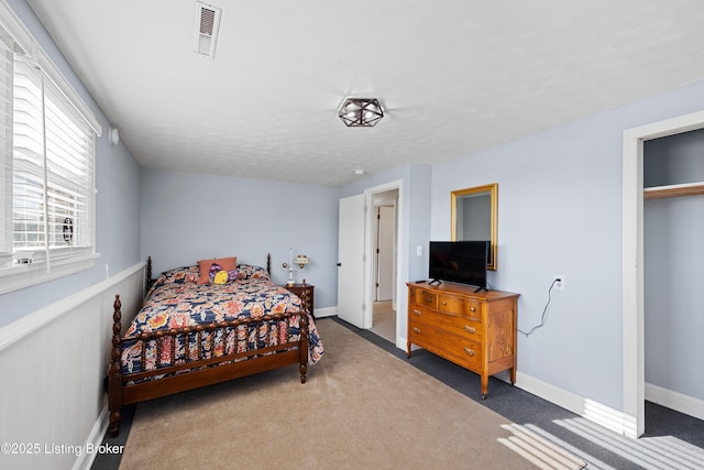 bedroom with dark carpet