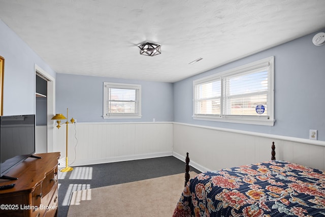 bedroom with dark carpet