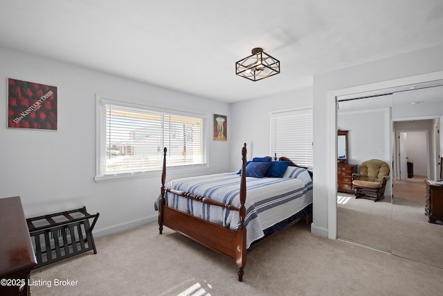 carpeted bedroom featuring a closet