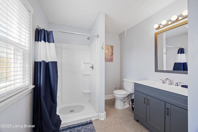 bathroom featuring curtained shower, tile patterned flooring, vanity, and a textured ceiling