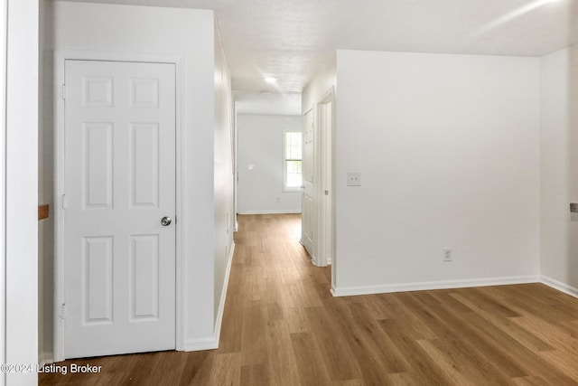 hall featuring wood-type flooring