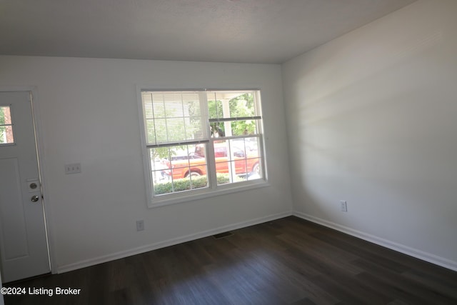 interior space with dark hardwood / wood-style flooring