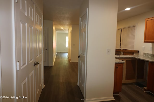 corridor with dark wood-type flooring