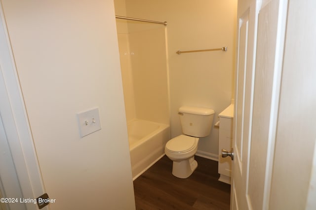 full bathroom featuring hardwood / wood-style floors, vanity, toilet, and shower / tub combination