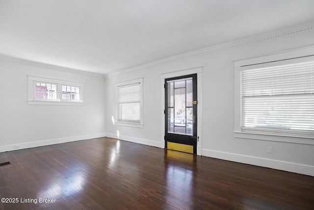 unfurnished room with ornamental molding, dark hardwood / wood-style floors, and a healthy amount of sunlight