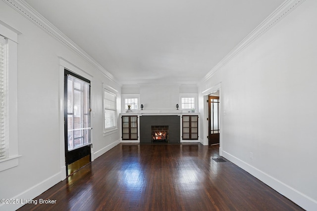 unfurnished living room featuring ornamental molding and dark hardwood / wood-style flooring