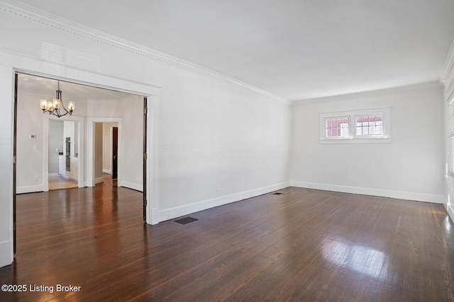 unfurnished room with a notable chandelier, crown molding, and dark hardwood / wood-style floors