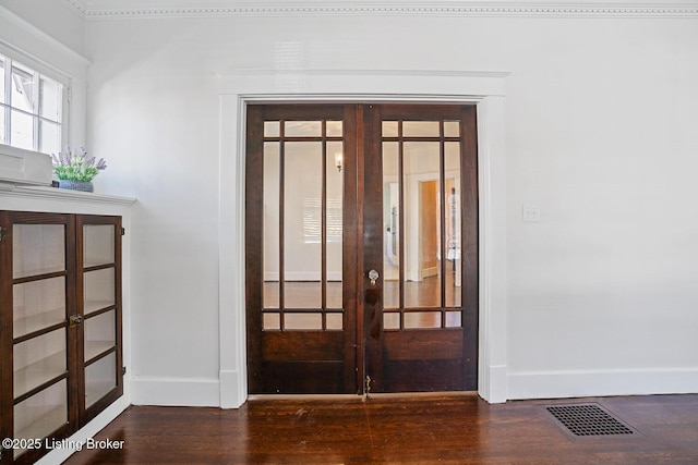 interior space with hardwood / wood-style floors and french doors