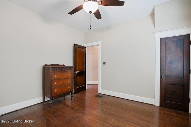 bedroom with ceiling fan and dark hardwood / wood-style flooring