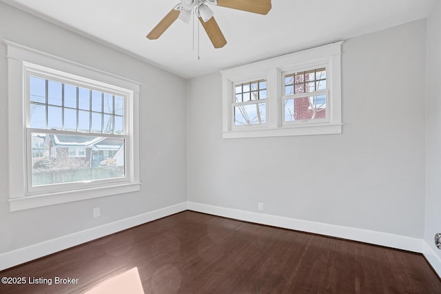 unfurnished room with ceiling fan, plenty of natural light, and dark hardwood / wood-style flooring