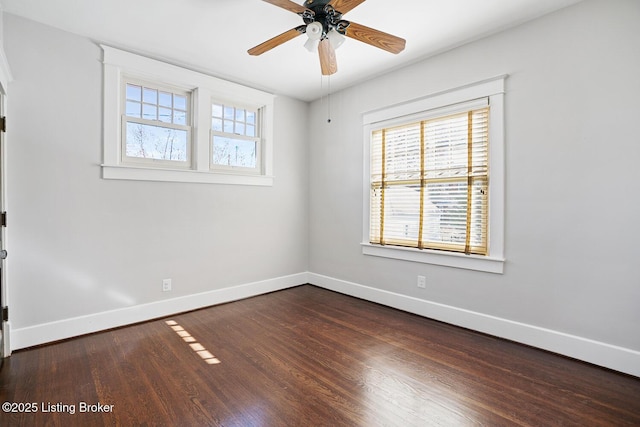 unfurnished room featuring dark hardwood / wood-style floors and ceiling fan