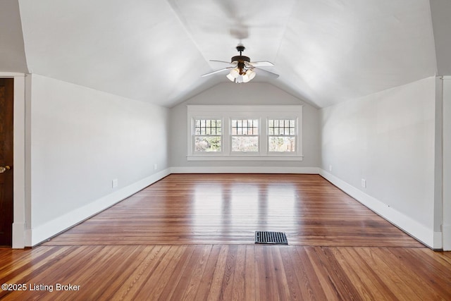 bonus room featuring ceiling fan, lofted ceiling, and hardwood / wood-style floors