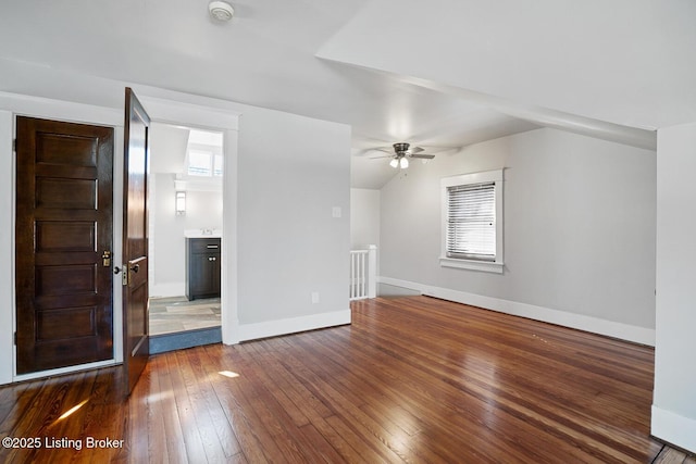 interior space featuring lofted ceiling, dark hardwood / wood-style floors, and ceiling fan