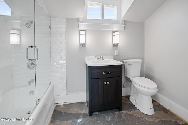 full bathroom featuring vanity, shower / bath combination with glass door, and toilet