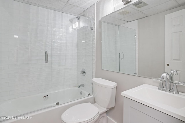 full bathroom featuring enclosed tub / shower combo, vanity, and toilet