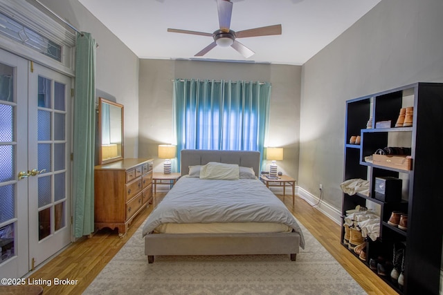 bedroom with ceiling fan and light hardwood / wood-style flooring