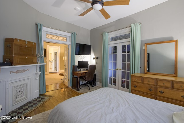 bedroom featuring light wood-type flooring, ceiling fan, and french doors