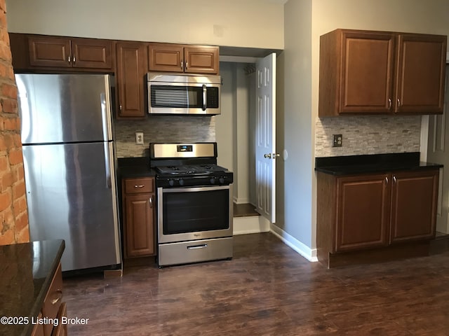 kitchen featuring decorative backsplash, dark hardwood / wood-style floors, and stainless steel appliances