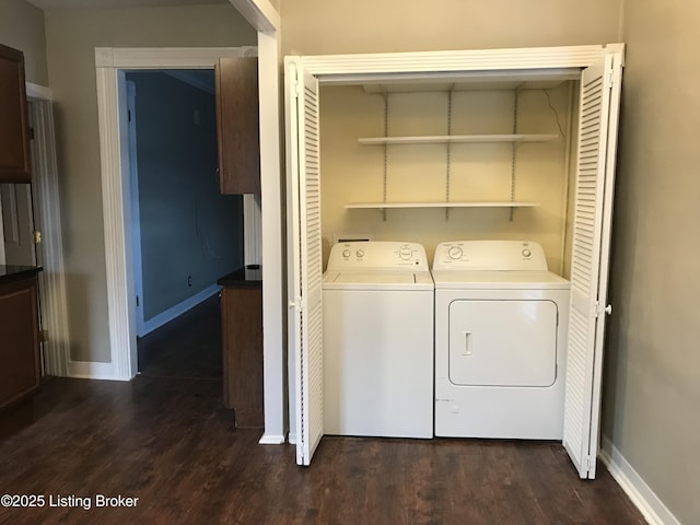 washroom featuring separate washer and dryer and dark hardwood / wood-style floors