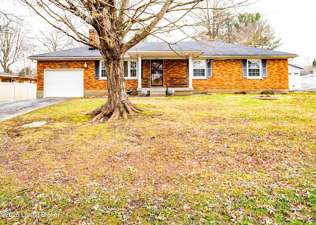 view of front of house featuring a front yard and a garage