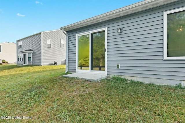 back of house featuring a yard