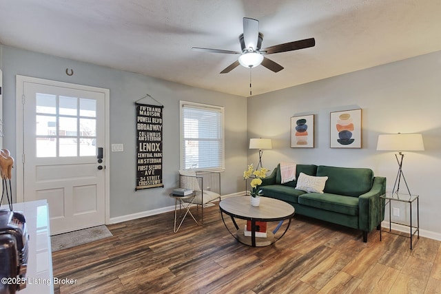 living room with dark hardwood / wood-style floors and ceiling fan