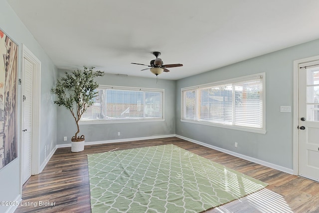 foyer entrance featuring ceiling fan and dark hardwood / wood-style flooring