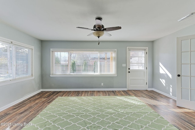 entryway with ceiling fan, a healthy amount of sunlight, and dark hardwood / wood-style flooring