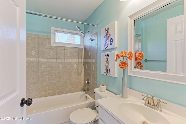 full bathroom with tiled shower / bath combo, vanity, and toilet