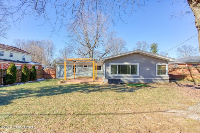 rear view of house featuring a lawn and a patio area