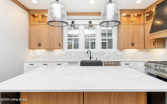 kitchen with white cabinets, decorative light fixtures, stainless steel appliances, and sink