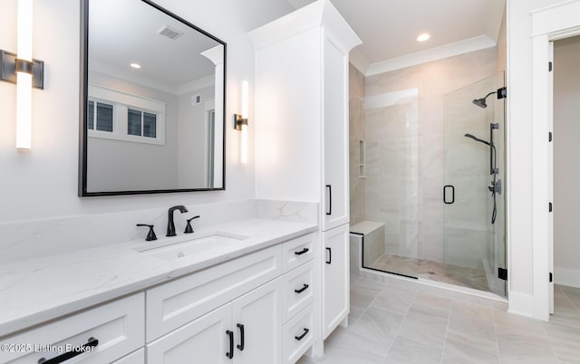 bathroom featuring vanity, tile patterned floors, a shower with door, and ornamental molding