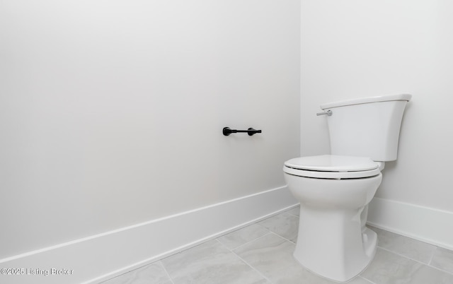 bathroom featuring tile patterned flooring and toilet