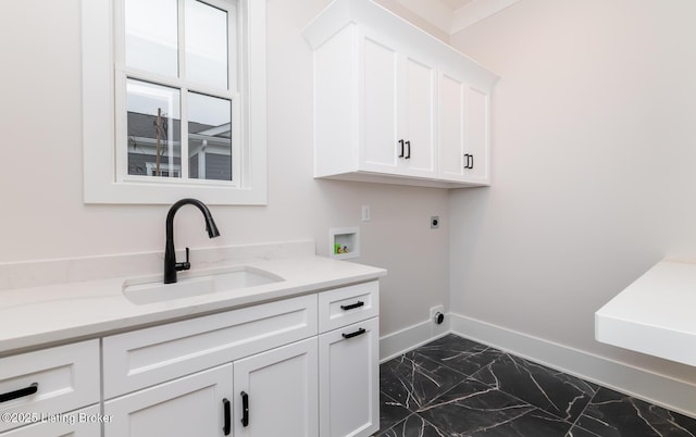 clothes washing area featuring cabinets, washer hookup, electric dryer hookup, and sink