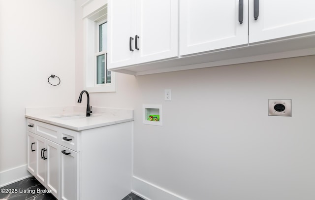 washroom featuring washer hookup, electric dryer hookup, cabinets, and sink