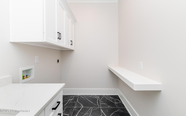 washroom with cabinets, hookup for a washing machine, and hookup for an electric dryer