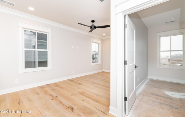 unfurnished room featuring ceiling fan, crown molding, and light wood-type flooring