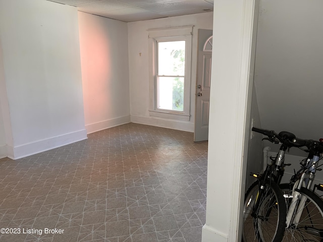 spare room with a paneled ceiling