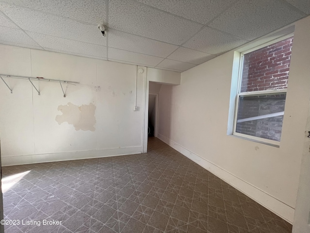 empty room with a drop ceiling